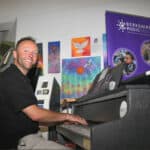 Jamie Read, Partnership and Inclusion Manager at Berkshire Music Trust, playing piano at Lower Earley Library