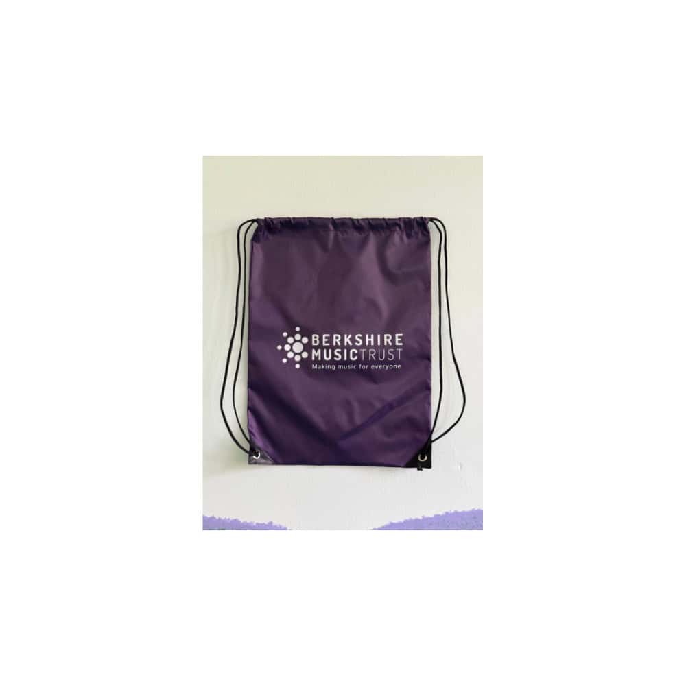 Purple drawstring bag featuring white Berkshire Music Trust logo